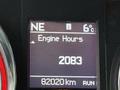 Display screen showing engine hours as 2083 and total kilometers as 82020 in a 2020 Dodge Grand Caravan