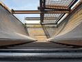 View from inside a 2013 International WorkStar truck bed showing metal sides and ladder rungs leading upward toward a metal grid structure
