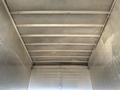 Interior of a 2011 Freightliner M2 106 truck showing the ceiling structure with metal beams and a smooth surface