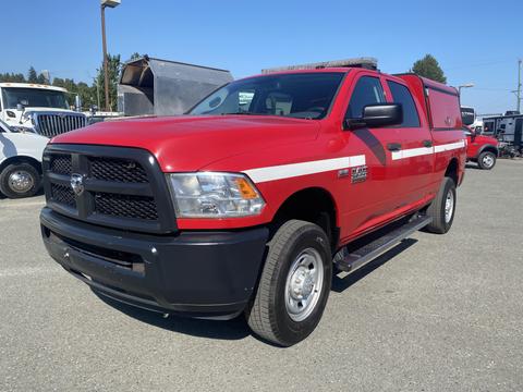 A red 2015 RAM 2500 pickup truck with a black front grille and a white stripe along the side