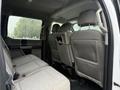 Interior of a 2020 Ford F-550 showing the backseat with gray fabric upholstery and two headrests visible