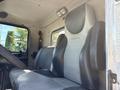 Interior view of a 2009 Kenworth T270 featuring a grey and black driver's seat with ergonomic design and a dashboard visible in the background