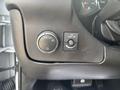 Dashboard controls of a 2021 Chevrolet Express including headlight switch and dome light button