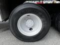A close-up view of a Goodyear tire mounted on a 2011 International 4400 featuring a silver wheel rim and visible tire tread pattern