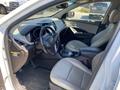 Interior of a 2018 Hyundai Santa Fe featuring leather seats a central console and dashboard with digital displays and controls