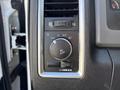 The image shows a control panel with dials and buttons for adjusting headlights and other settings in a 2014 RAM 5500 vehicle