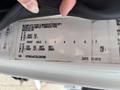A close-up of a vehicle information label from a 2013 International WorkStar showing specifications like weight and axle details