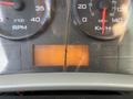 Dashboard of a 2012 International DuraStar 4300 displaying RPM speedometer fuel gauge and odometer showing 32250 KM