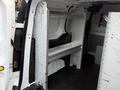 A 2017 Ford Transit Connect interior featuring a metallic shelving unit mounted inside the cargo space