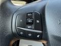Close-up of the steering wheel control panel with buttons for setting cruise control and adjusting audio settings on a 2020 Ford Escape