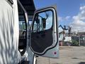 White 2019 Freightliner M2 106 truck with the driver's side door open displaying the interior and dashboard details