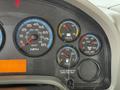 Dashboard of a 2011 International 4300 showing speedometer fuel voltage and air pressure gauges with a mileage display