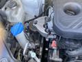 The engine compartment of a 2018 Hyundai Santa Fe showcasing the engine components and various mechanical parts