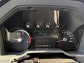 Dashboard of a 2015 Ford F-550 showing speedometer and odometer with a reading of 75538.2 kilometers