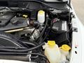 The engine compartment of a 2008 Sterling Bullet featuring various components including a reservoir tank battery and electrical connections