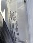 A white label on a vehicle displaying tire specifications including size pressure ratings and load information for a 2014 International 7400