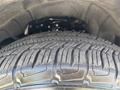 Close-up view of a tire on a 2017 Chevrolet Colorado showcasing the tread pattern and details of the wheel rim