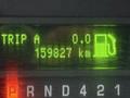 Display panel of a 2017 Ford E450 showing trip A as 0 and total mileage as 159827 km with a fuel icon