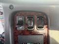 Close-up of the dashboard controls in a 2022 Freightliner M2 106 featuring multiple switches for headlights and additional functions