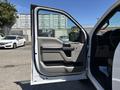 A 2019 Ford F-150 truck door is open showing the interior design and handle details