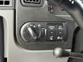 Control panel of a 2022 International MV607 featuring knobs and buttons for lights mirror heat and lift gate controls