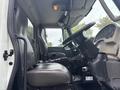Interior view of a 2013 International DuraStar 4300 showing the driver's seat steering wheel and dashboard controls