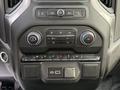 Dashboard controls of a 2024 Chevrolet Silverado 1500 featuring climate control buttons and media system controls
