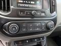 The image shows the dashboard controls of a 2018 Chevrolet Colorado including climate controls and audio settings