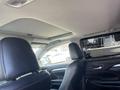 Interior view of a 2018 Toyota Highlander showing the back of front seats and the headrests with a sunroof overhead