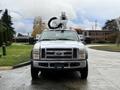 A 2008 Ford F-550 truck with a bucket lift attached on top facing forward