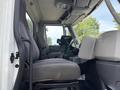 Interior view of a 2013 International WorkStar showing the driver's seat dashboard and steering wheel