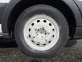 Close-up of a white wheel and tire from a 2016 Ford Transit showing the rim and tread pattern