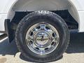 A chrome wheel and tire from a 2019 Ford F-150 showcasing a shiny rim with a rugged tread pattern