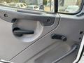 Interior door panel of a 2016 Freightliner M2 106 featuring a handle and a latch mechanism