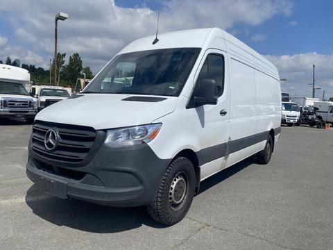 A 2024 Mercedes-Benz Sprinter van with a white exterior and black accents parked on a lot