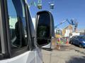 A 2023 Mercedes-Benz Sprinter 2500 side mirror with a black frame and signaling light