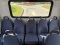 Interior seating of a 2017 Chevrolet Express with multiple fabric-covered seats arranged in a row