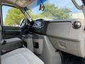 Interior view of a 2018 Ford E-450 showcasing the dashboard controls seats and console area