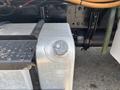 A silver fuel tank with a black cap is mounted on the side of a Freightliner M2 106 truck