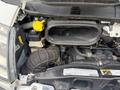 Engine compartment of a 2020 RAM Promaster showing various components including the air intake and fluid reservoirs