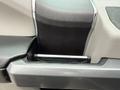 A close-up of the console area in a 2018 Ford F-150 showing a sleek design with a metallic handle and textured surfaces