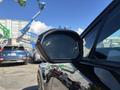 Side view mirror of a 2023 Fisker Ocean showcasing a modern and sleek design