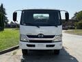 Front view of a 2012 Hino 155 truck with a white body and distinctive headlights