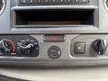 Dashboard controls of a 2022 Ford E-450 featuring knobs for temperature and ventilation a USB port and a button for hazard lights