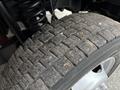 Close-up of a heavily treaded tire on a 2018 Ford F-550 showcasing the rubber pattern and texture