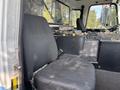 A black driver's seat inside a 2011 Autocar Xpeditor truck displaying a simple design without additional upholstery details