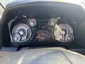 Dashboard of a 2018 RAM 3500 featuring speedometer tachometer fuel and temperature gauges along with a navigation display and various indicator lights