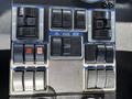 Control panel of a 2012 Autocar Xpert featuring multiple toggle switches for various functions including lights, water functions, and brooms
