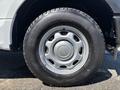 A close-up of the wheel and tire of a 2019 Ford F-150 featuring a silver wheel rim and a large black tire with a rugged tread pattern