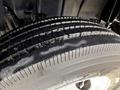 Close-up of a wet tire tread on a 2014 International TerraStar showing deep grooves and patterns for traction